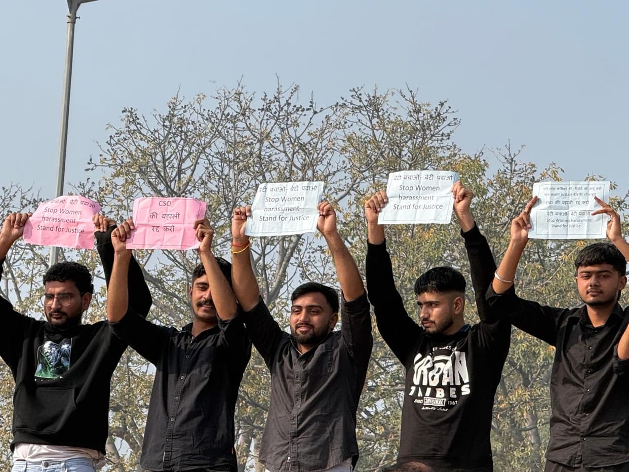 Students dressed in black protested in front of the HAU Vice Chancellor.