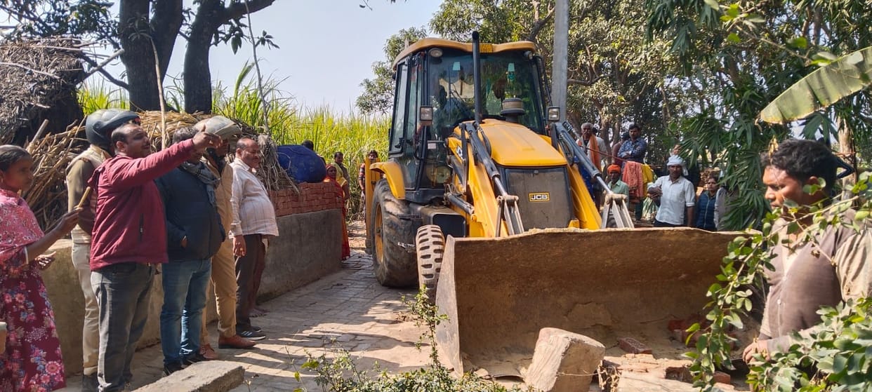 Bulldozer moves on unauthorized road, woman faints amidst commotion