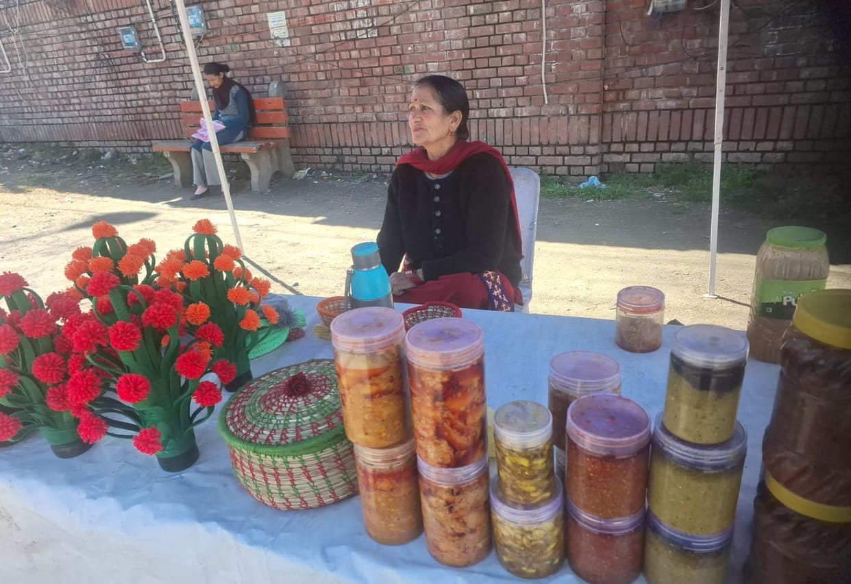 Women earning money by selling baskets, pickles and sweets
