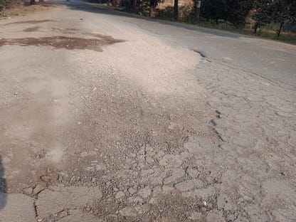 Pebbles scattered on the approach road of the four-lane