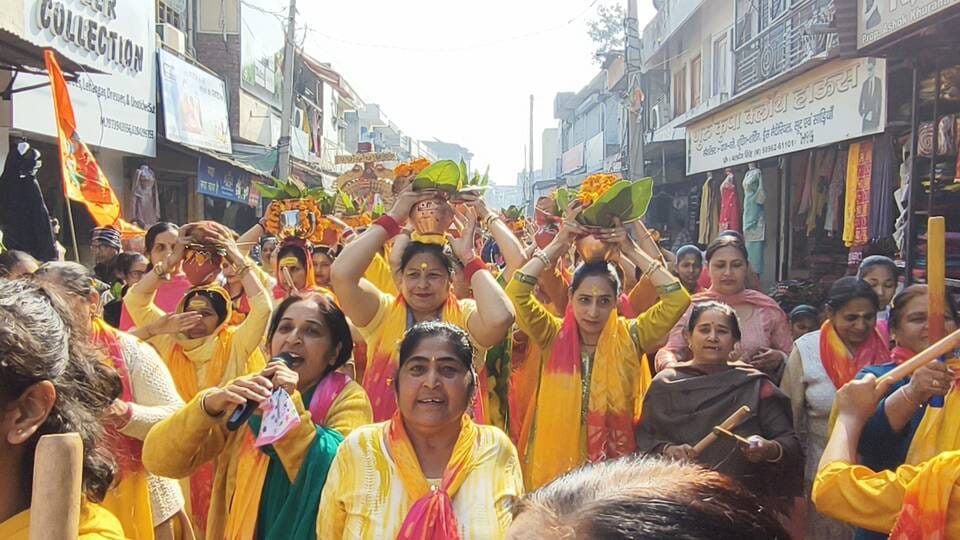Women sang hymns with pots on their heads.
