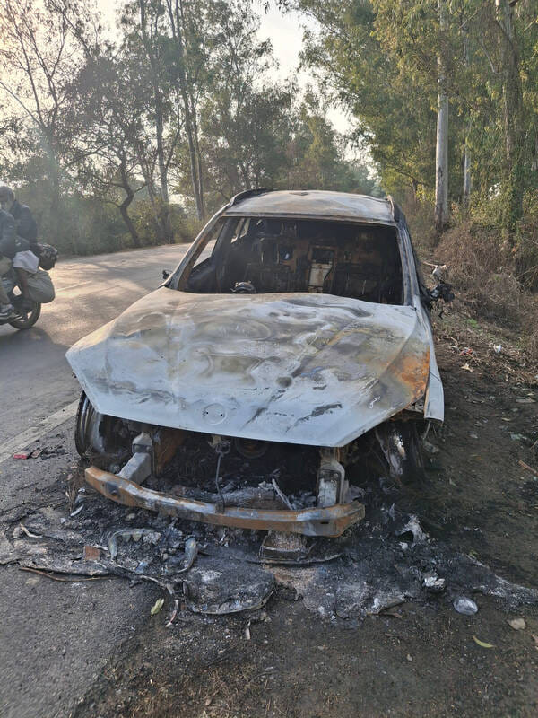 Two young men narrowly escape a car fire