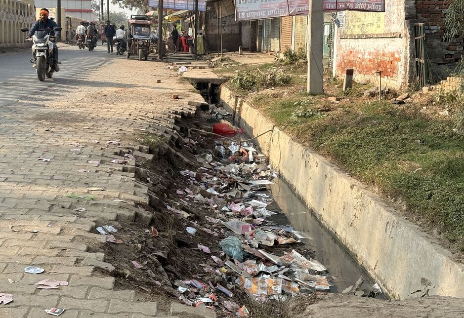 Drains are open at some places and filled with garbage at others, increasing the risk of accidents.