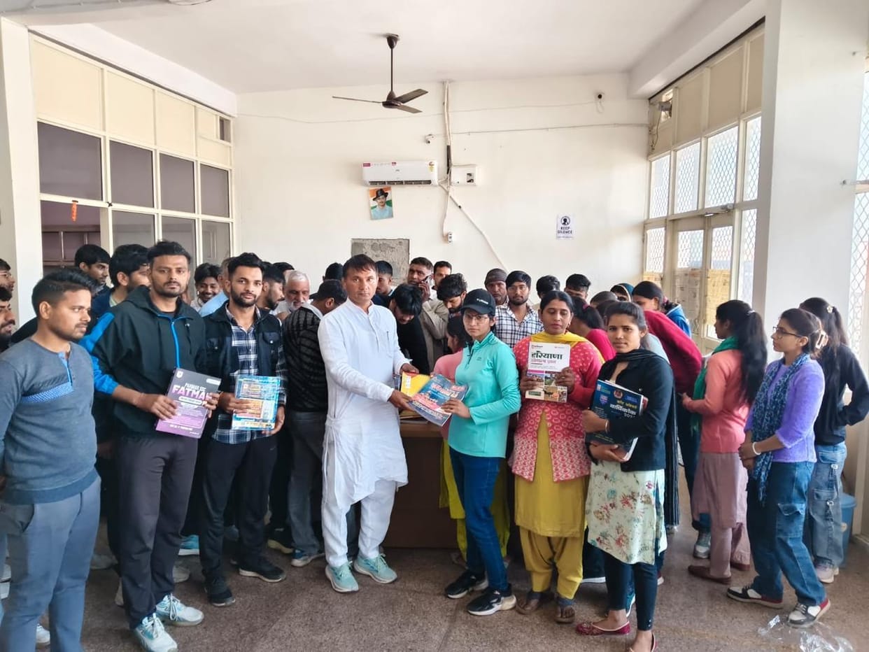 The chairman presented books to the students.
