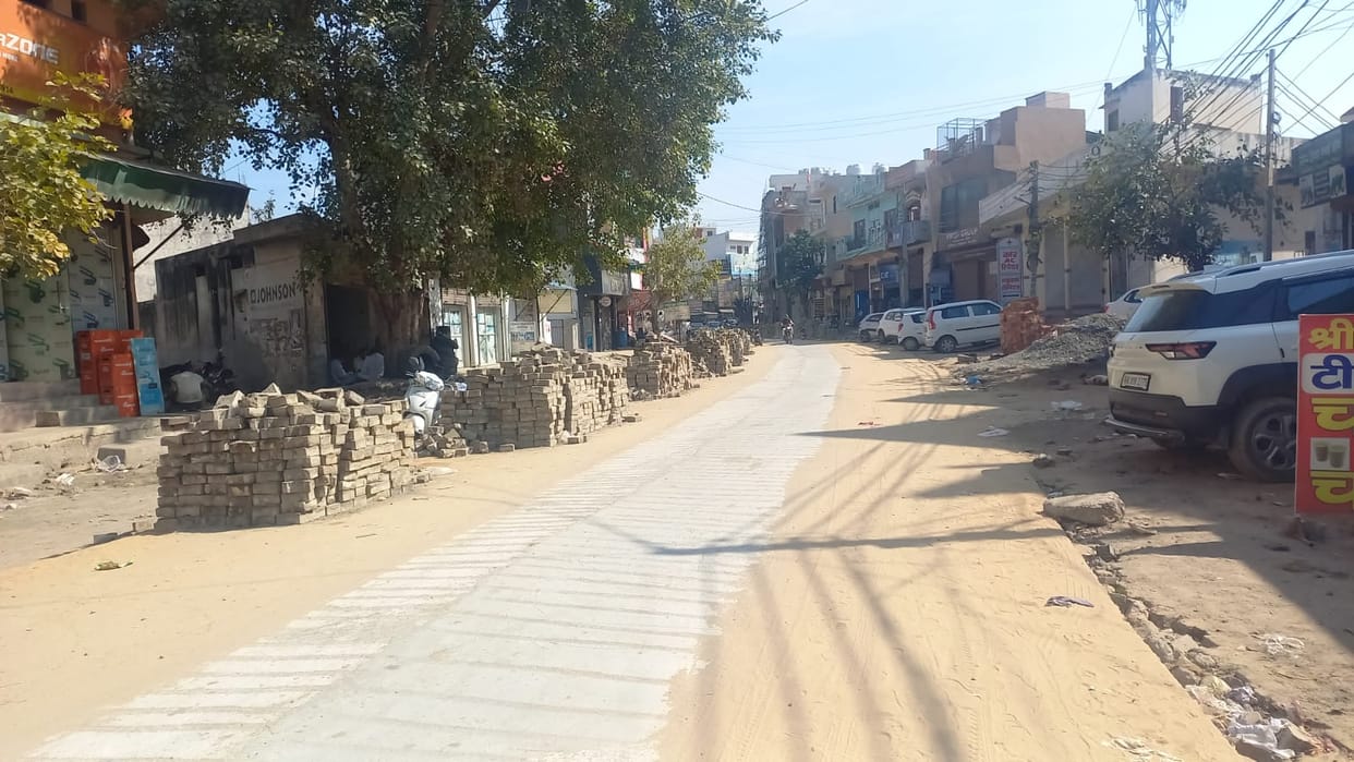 Road construction work is progressing slowly, stalling the business of shopkeepers.