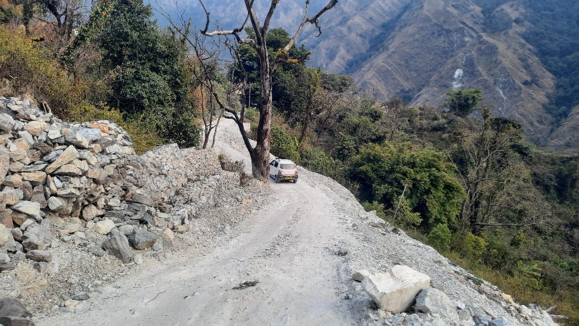 A tree that fell on the road due to a landslide held up the wheels of a roadways bus.