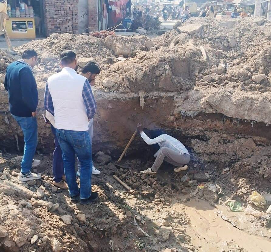 The road at Hanuman Gate Chowk was sinking due to old blocked drains and pipeline leakage.