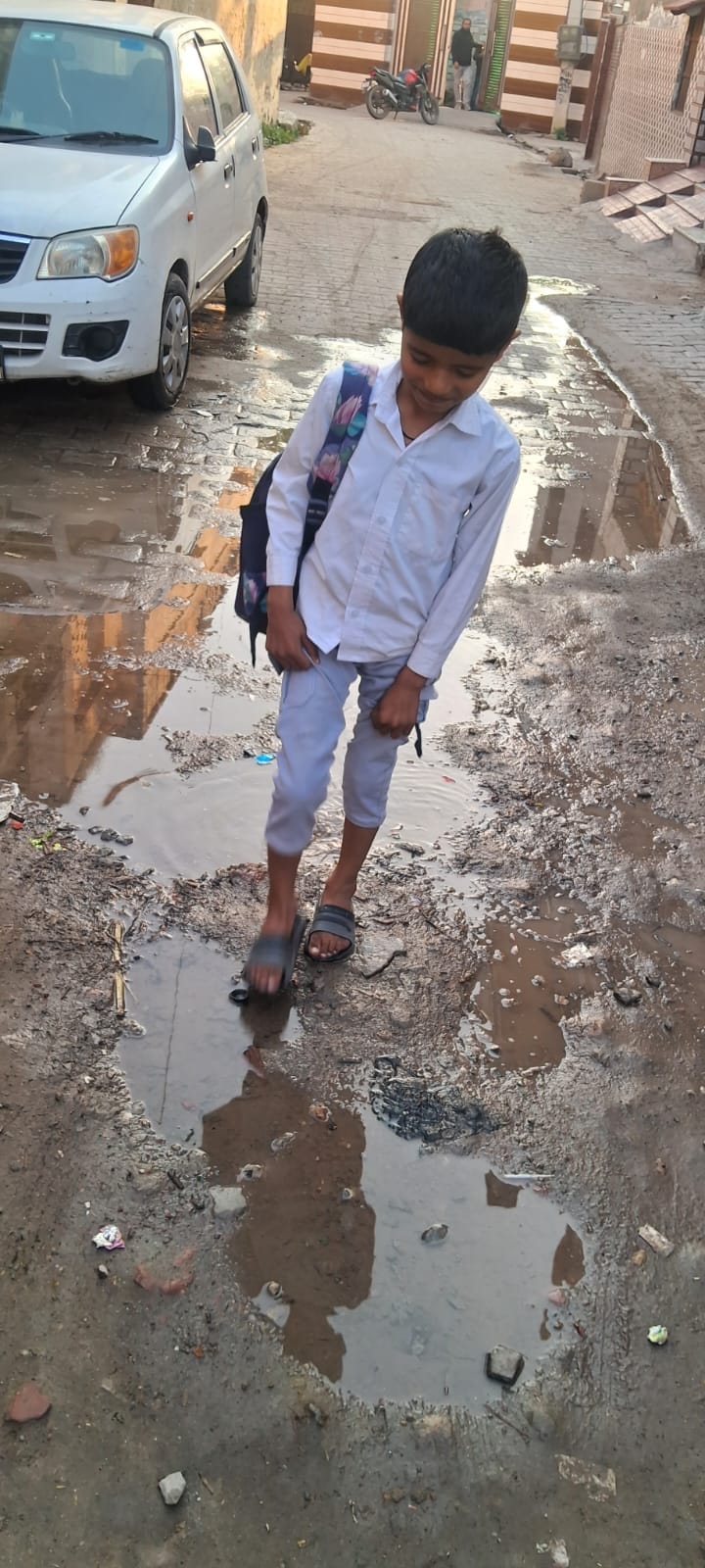 Water flowing on the road due to broken pipelineWater flowing on the road due to broken pipeline