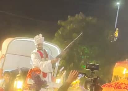shivpuri-The groom riding in a carriage and firing celebratory shots from a car in the wedding