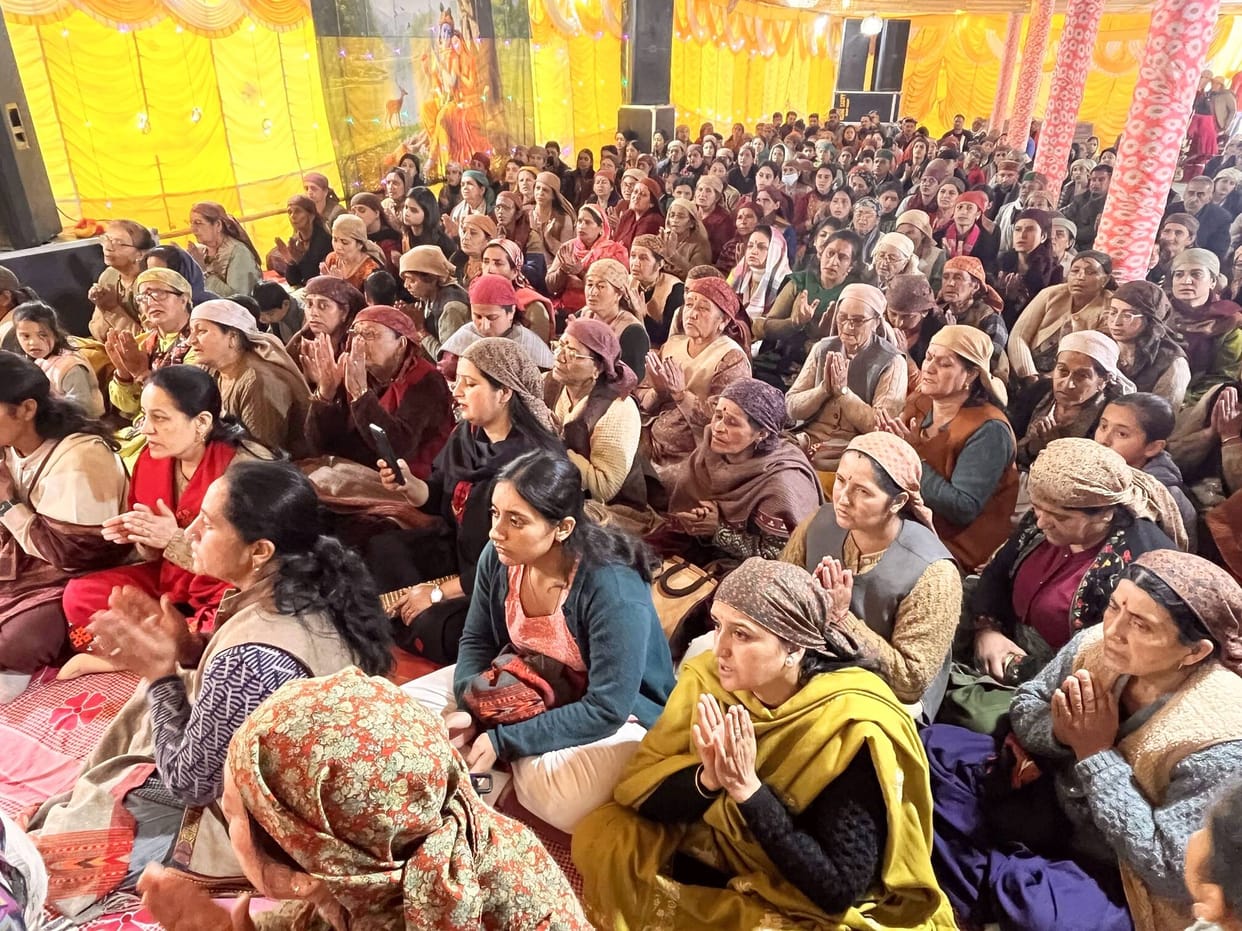 Devotees immersed in devotion during the Srimad Bhagwat Katha in Theog