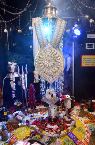 Bholenath, seated in silver form, appeared as a groom riding on Nandi.Bholenath, seated in silver form, appeared as a groom riding on Nandi.