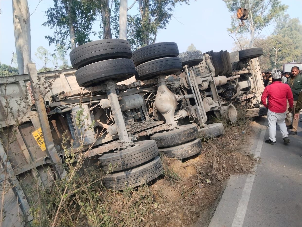 Dust-laden truck overturns in ditch, three injured