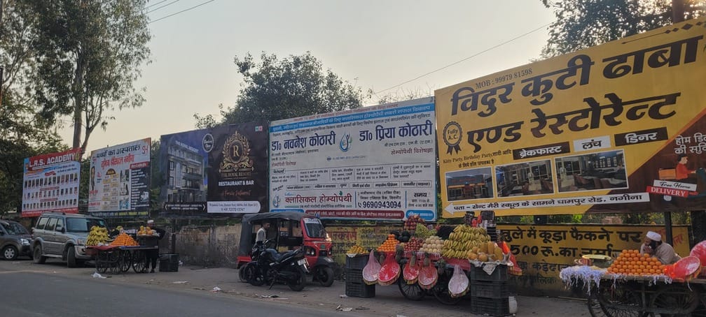 Illegal hoardings and unipoles litter the city