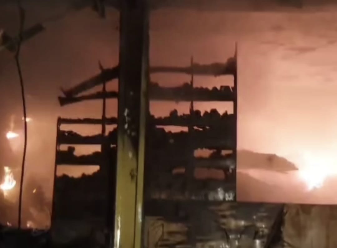 A hundred-year-old grocery store caught fire due to a short circuit, burning goods worth crores to ashes.