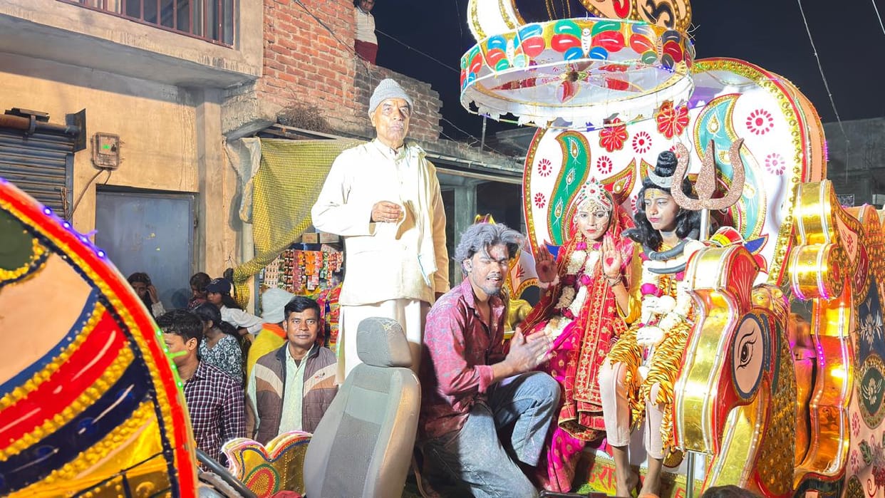 People danced to devotional songs in the Shiva procession.