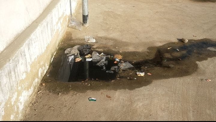 Dirty water flowing on the road due to manhole overflow