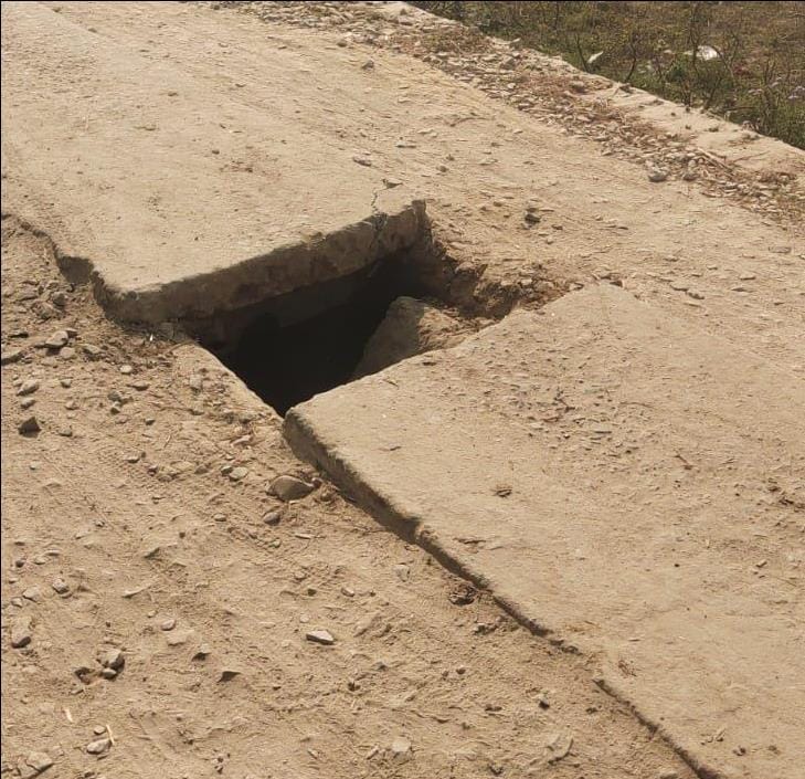 800 meter CC road and slab broken at 9 places on the drain