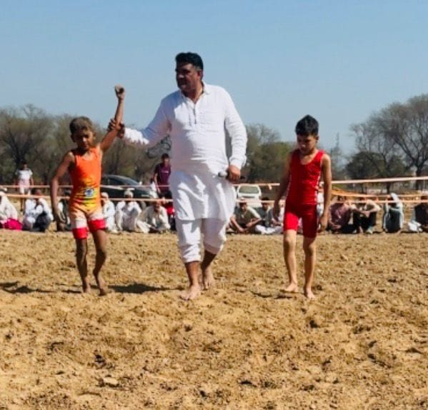 In the wrestling arena, the girls defeated the boys and won the title.