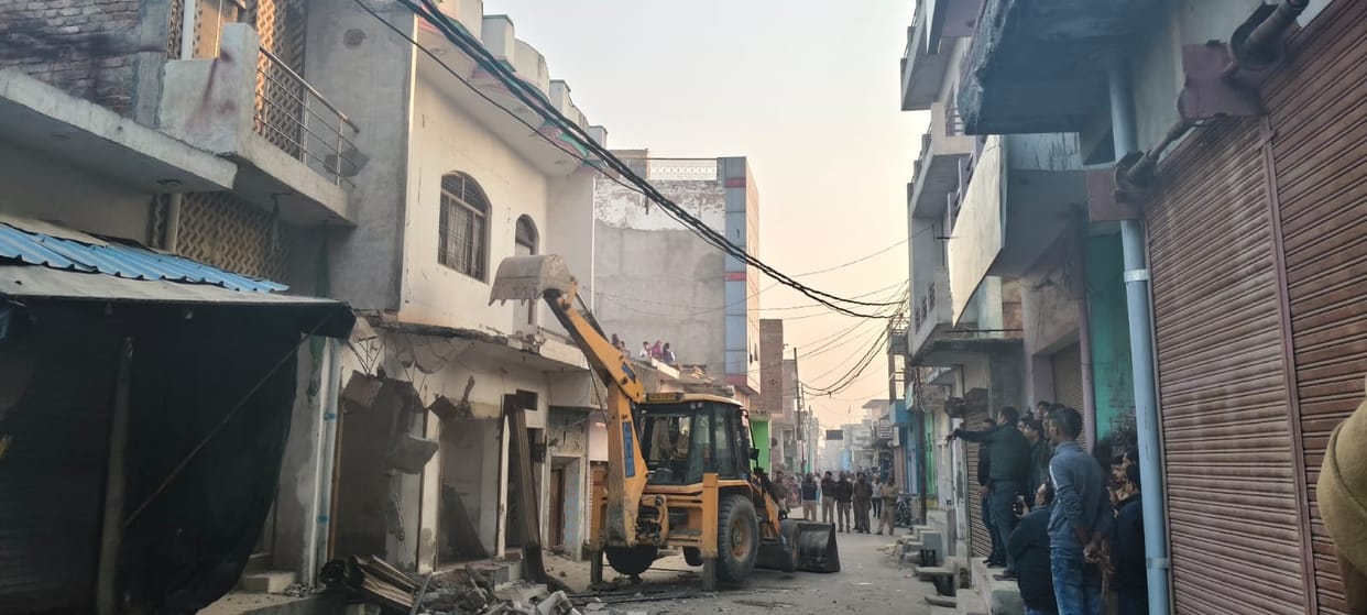 Bulldozers razed the houses and shops of three gang rape accused.