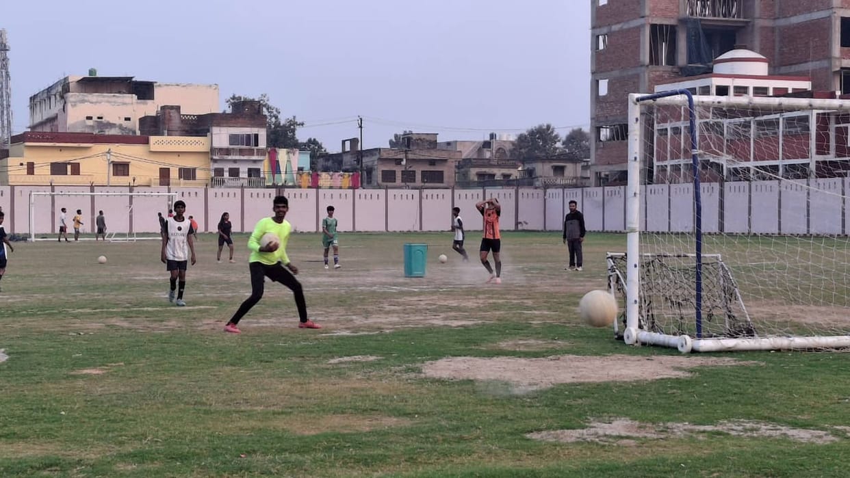 New football saplings practicing at the goal post