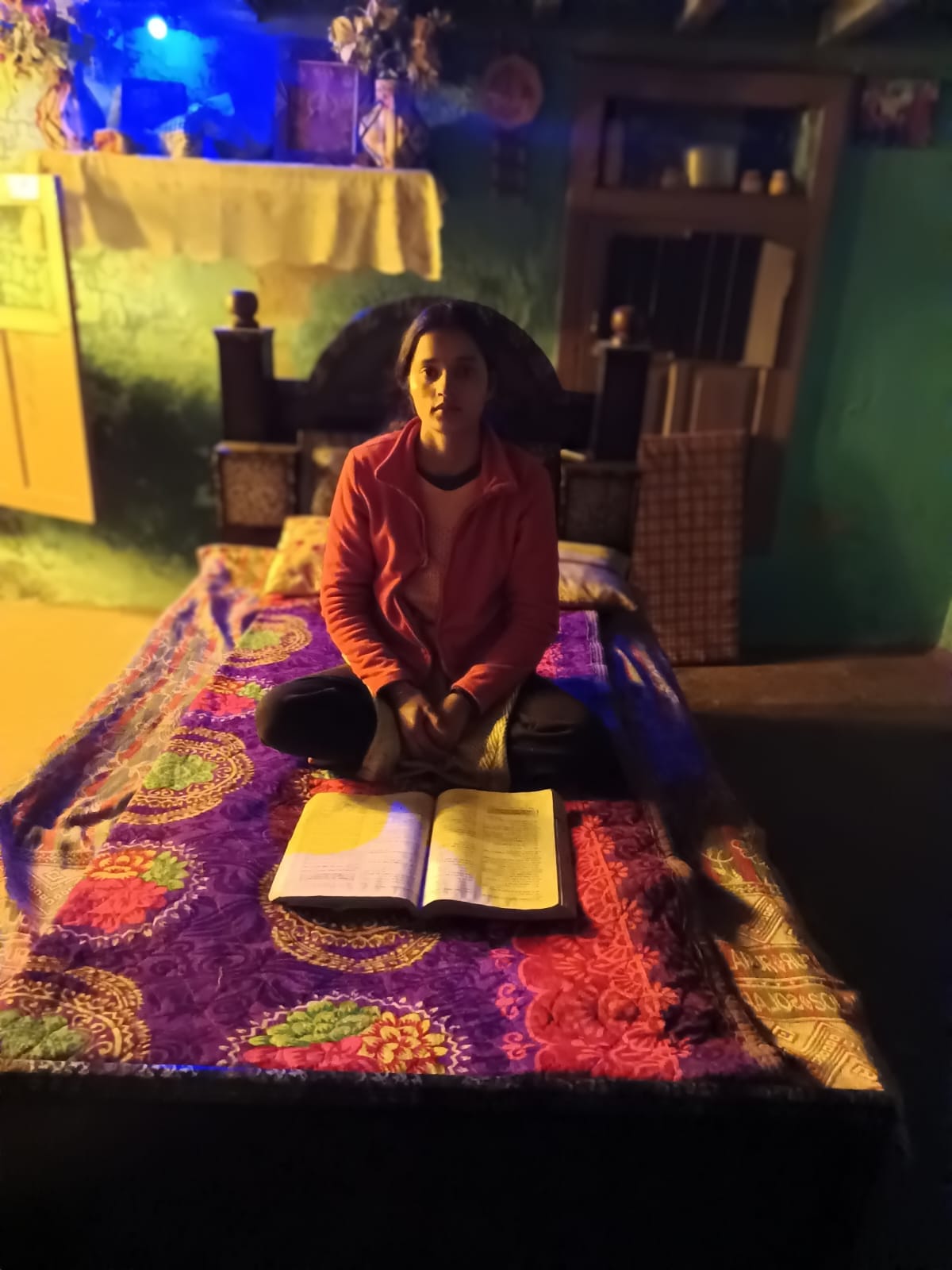 The flame of education burning with the help of a candle in dim light