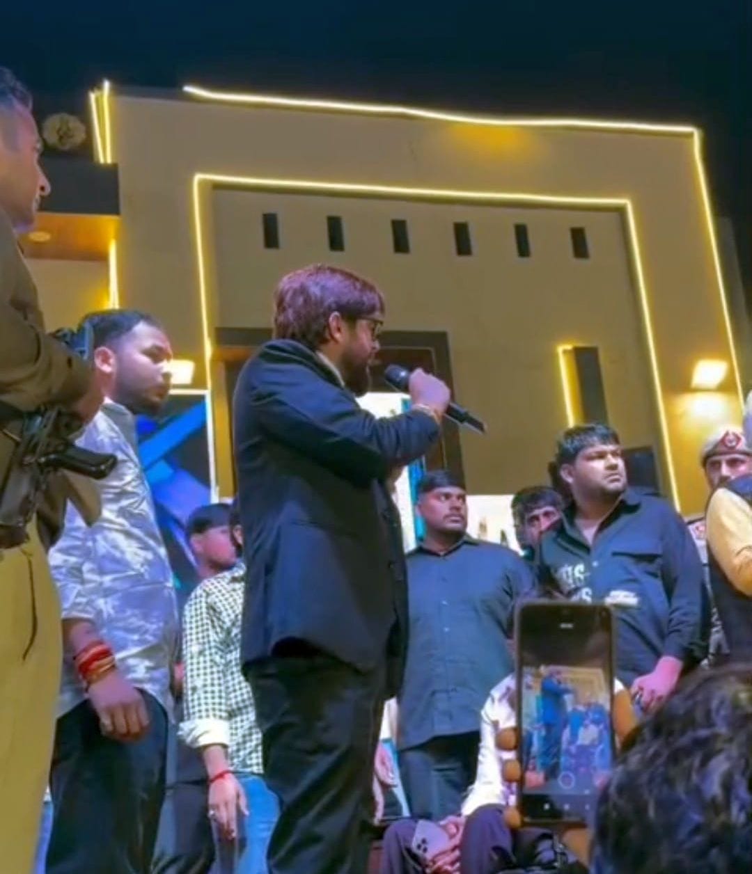 Singer Masoom Sharma removed the former Sarpanch from the stage.