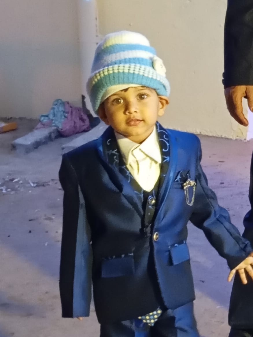 A six-year-old boy died after being hit by a tractor-trolley while playing.