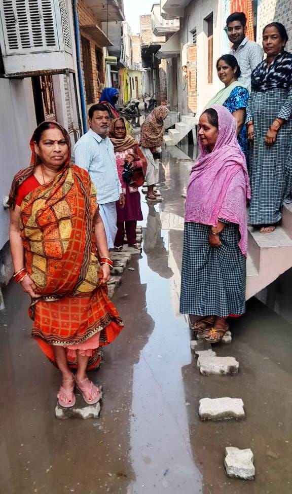 The streets of Muradganj are filled with water, making it difficult to get out.
