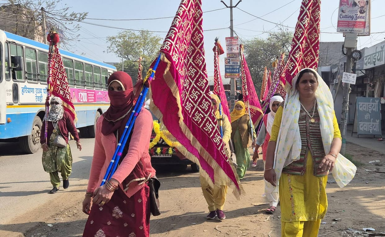 Devotees set out on a pilgrimage carrying the Nishan to Khatu Shyam Dham.