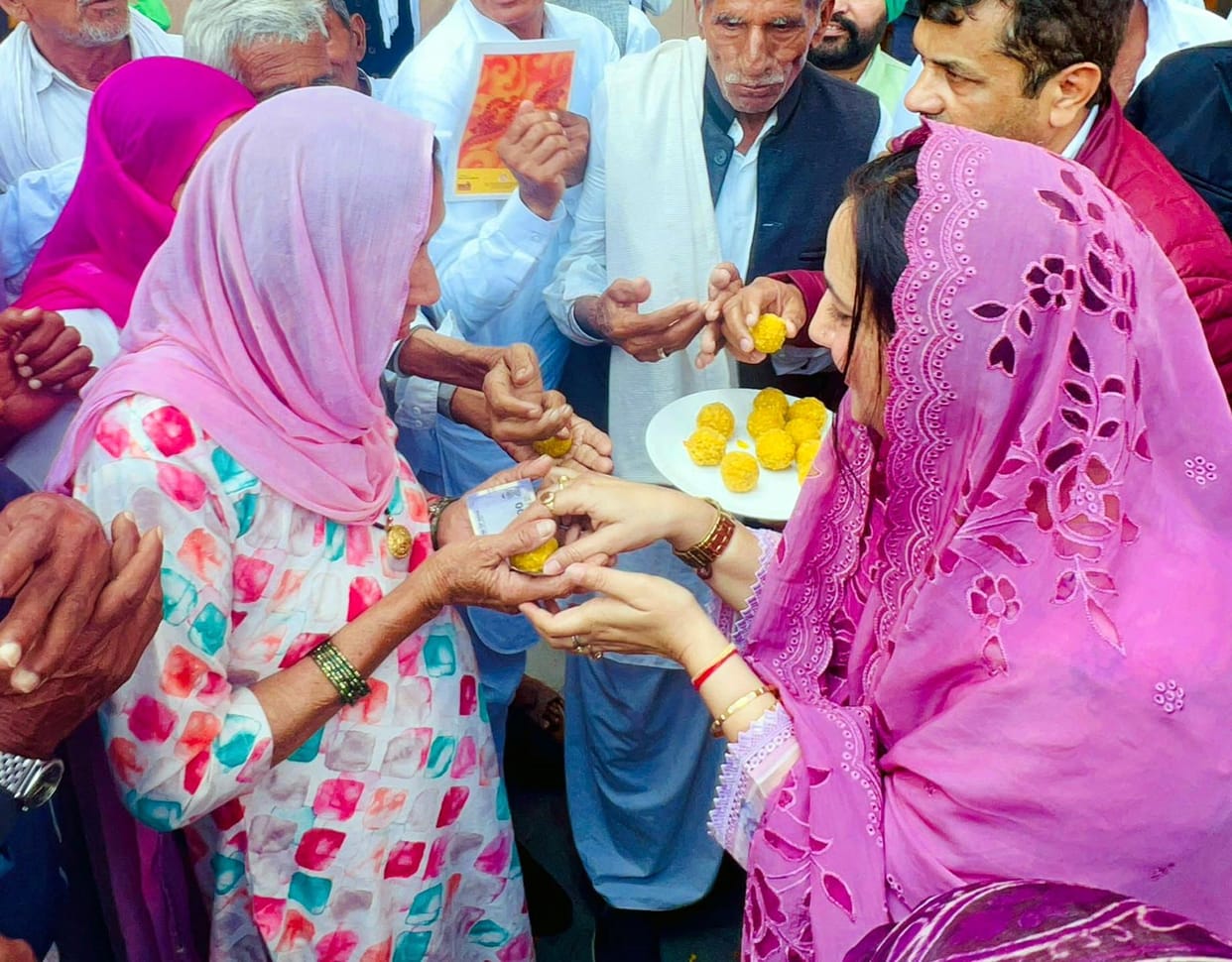 Celebrations mark pension restoration, elderly honoured with 100 rupees and laddus