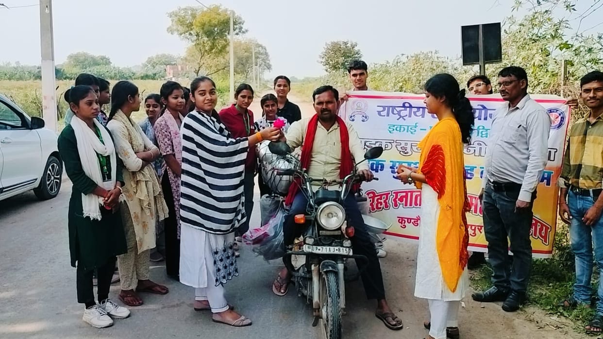 Gifting roses to drivers and advising them to wear helmets