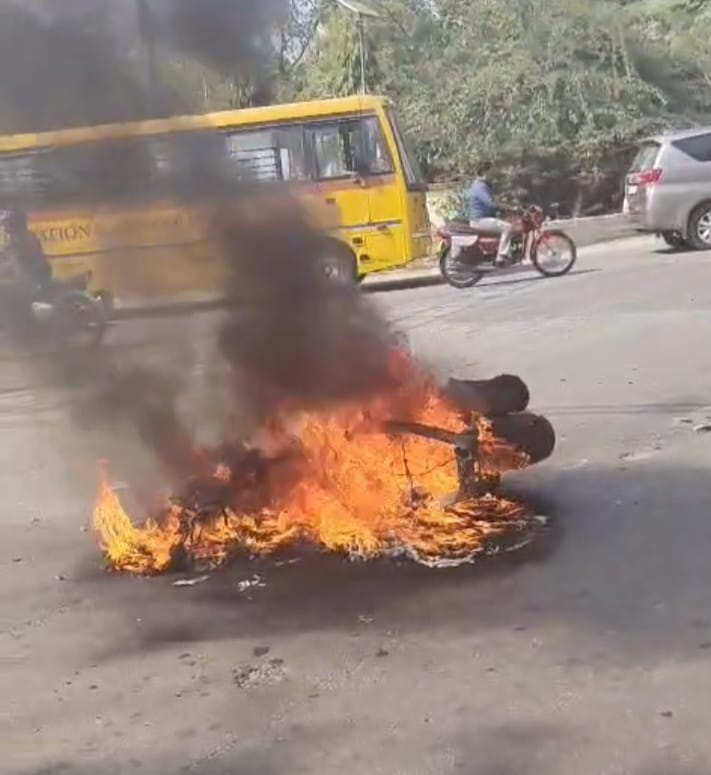 Student's scooter catches fire after colliding with a policeman's car