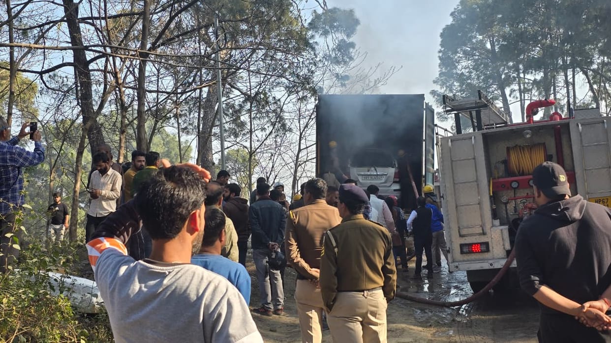 A moving container truck caught fire in Pucca Bharo, burning a car and a bike.