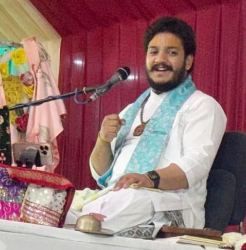 The temple resounded with chants of Sri Krishna's praises.