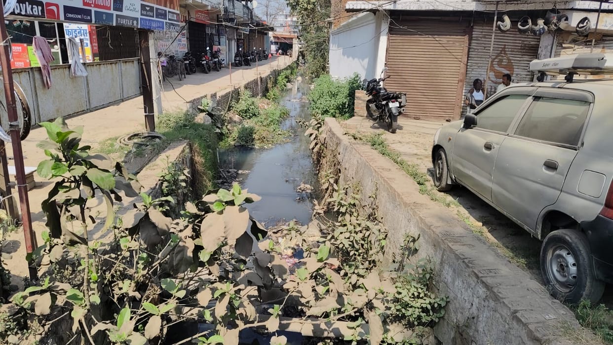Open drains and dug pits, deadly roads