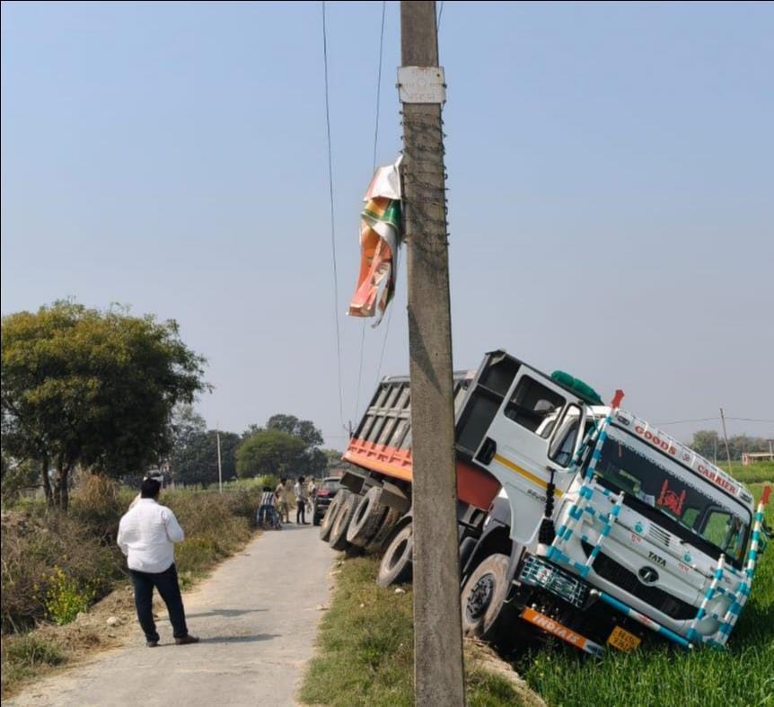 Driver and helper narrowly escape: Truck loaded with sand comes in contact with high tension line