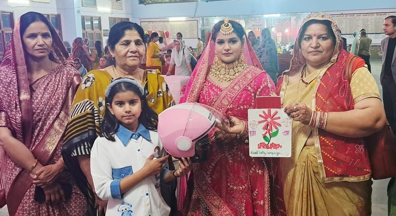 The message of road safety was given by distributing helmets and reflectors at the wedding.