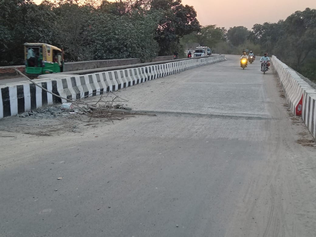 The front portion of the Mansaita river bridge, built two months ago, has collapsed