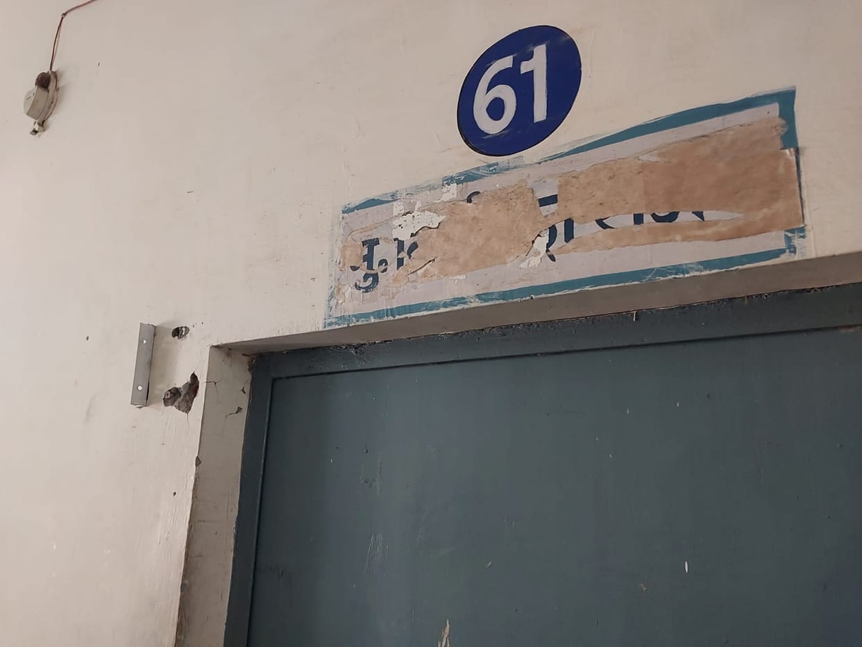 The pathologist went on leave after removing the board outside the room.
