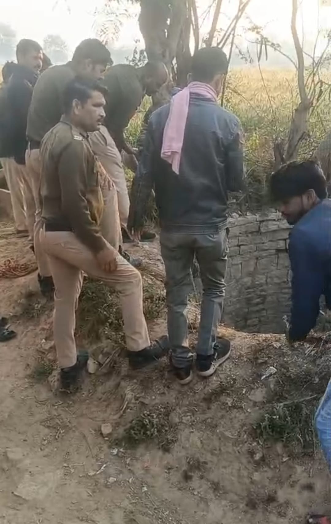 Accused of pushing a woman into a well during a police raid