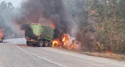 Two vehicles collide, one driver trapped in burning cabin, dies.