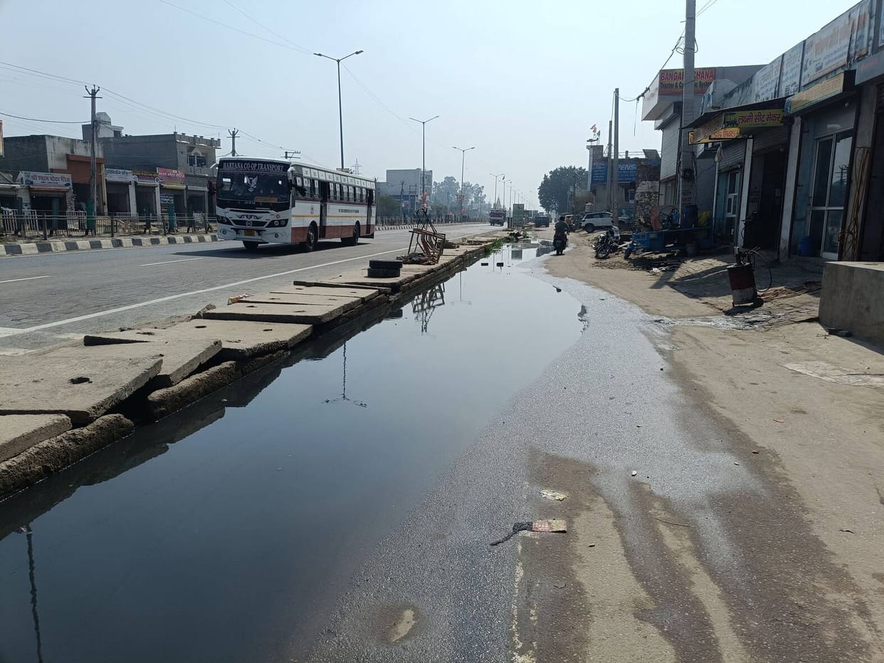 Water filled on the service road due to blockage of drain