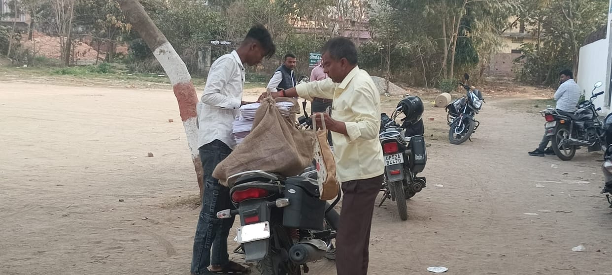 Despite the ban, answer sheets are being transported by bike.
