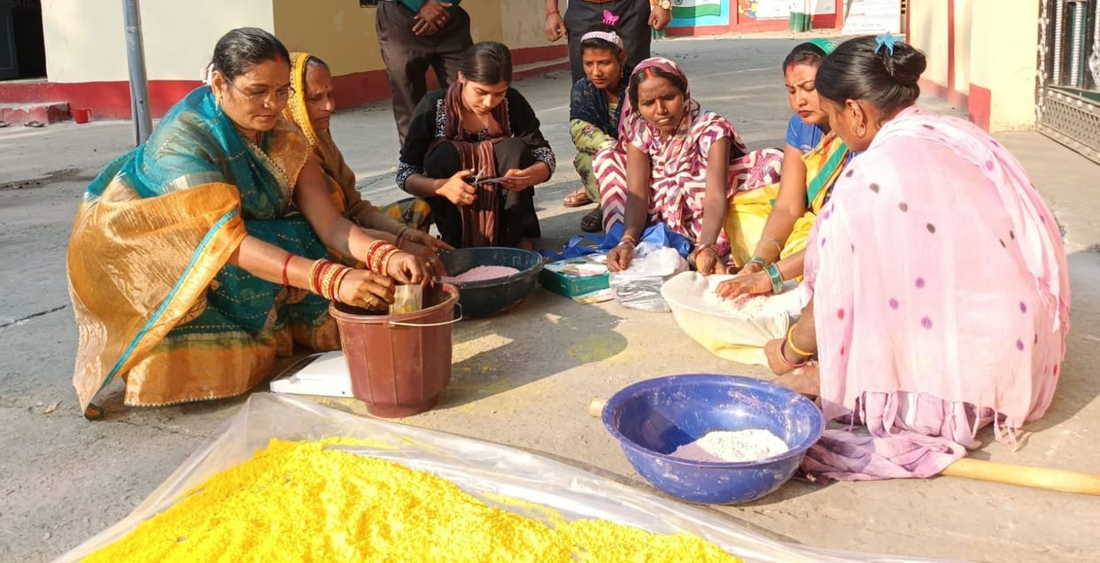 Herbal gulal being prepared from turmeric and sandalwood