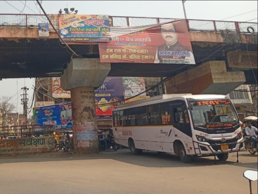 The city is filled with hoardings hanging from bamboo poles.