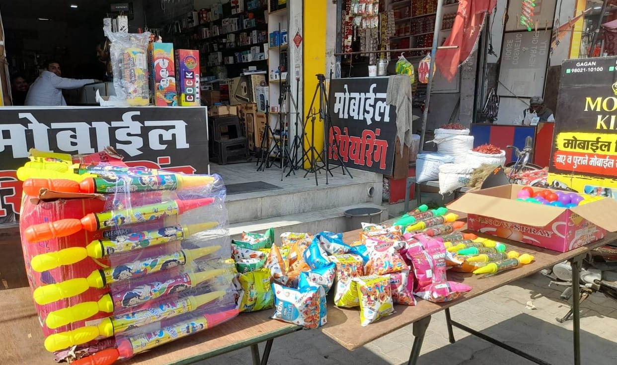 Shops selling colours, gulal and pichkaris are decorated.