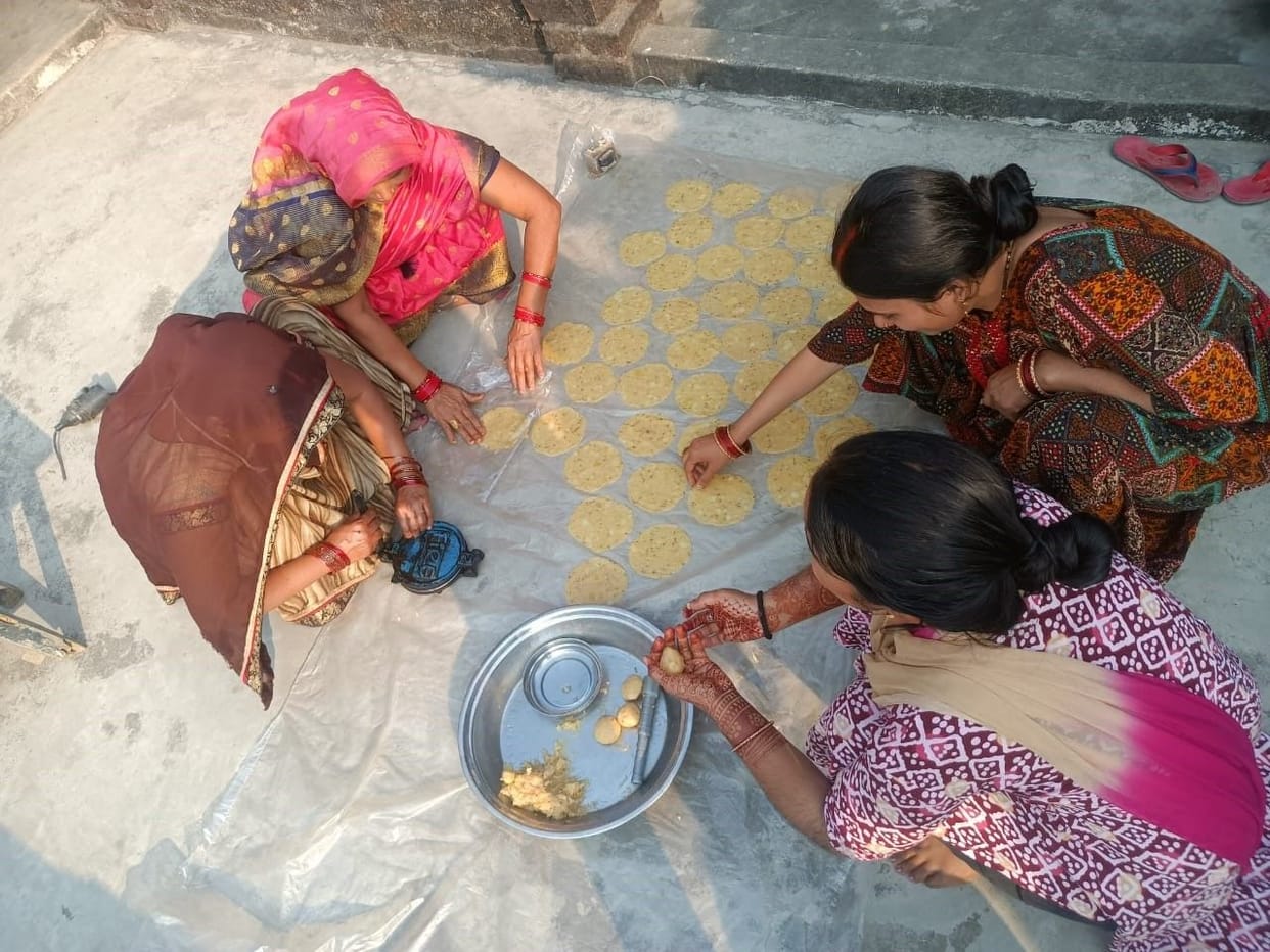 Homes and courtyards are filled with the fragrance of Holi delicacies