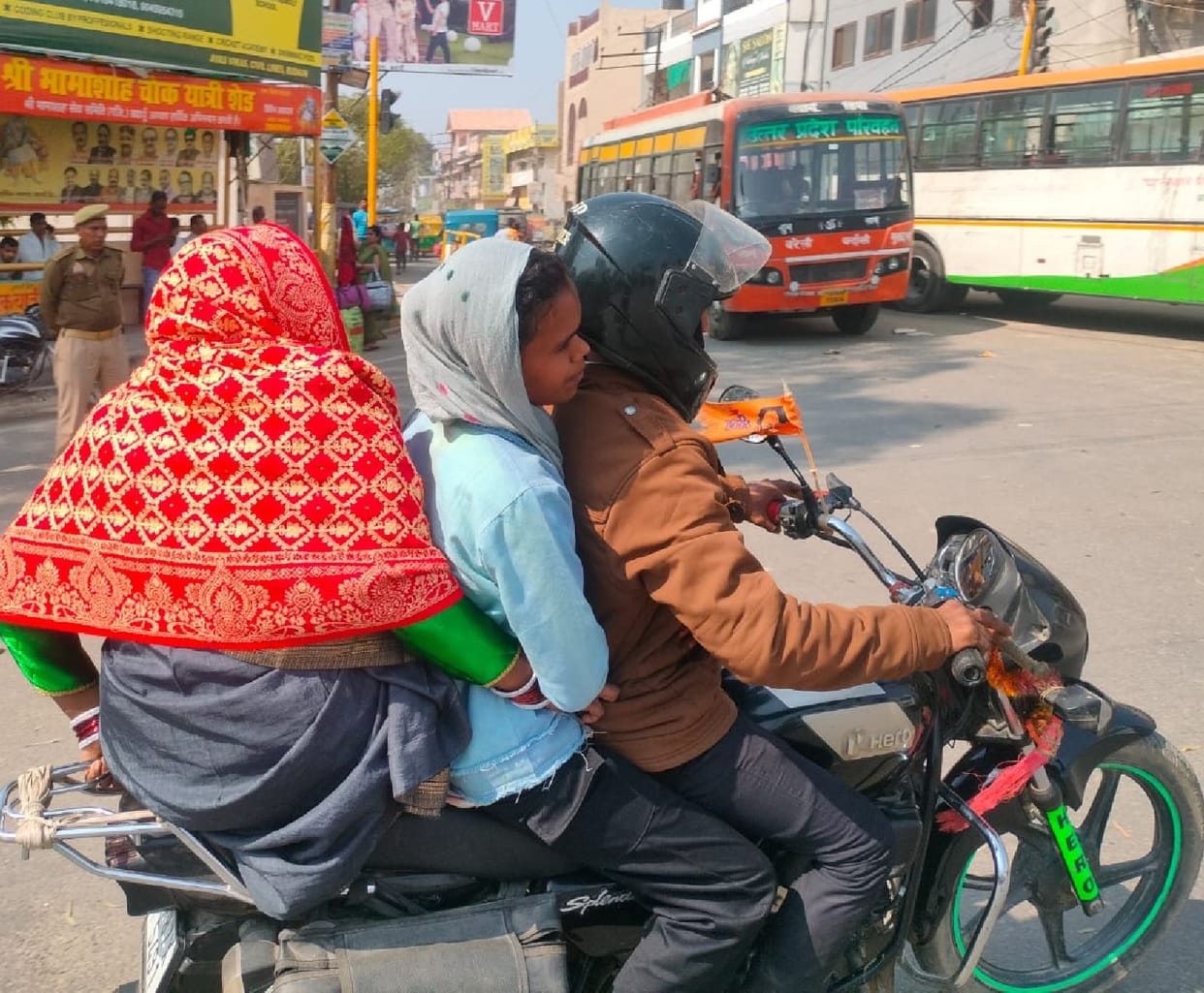 Four people riding on one bike... no worries about rules, no love.