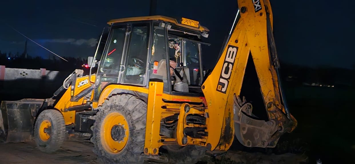 JCB driver and three others arrested for digging road