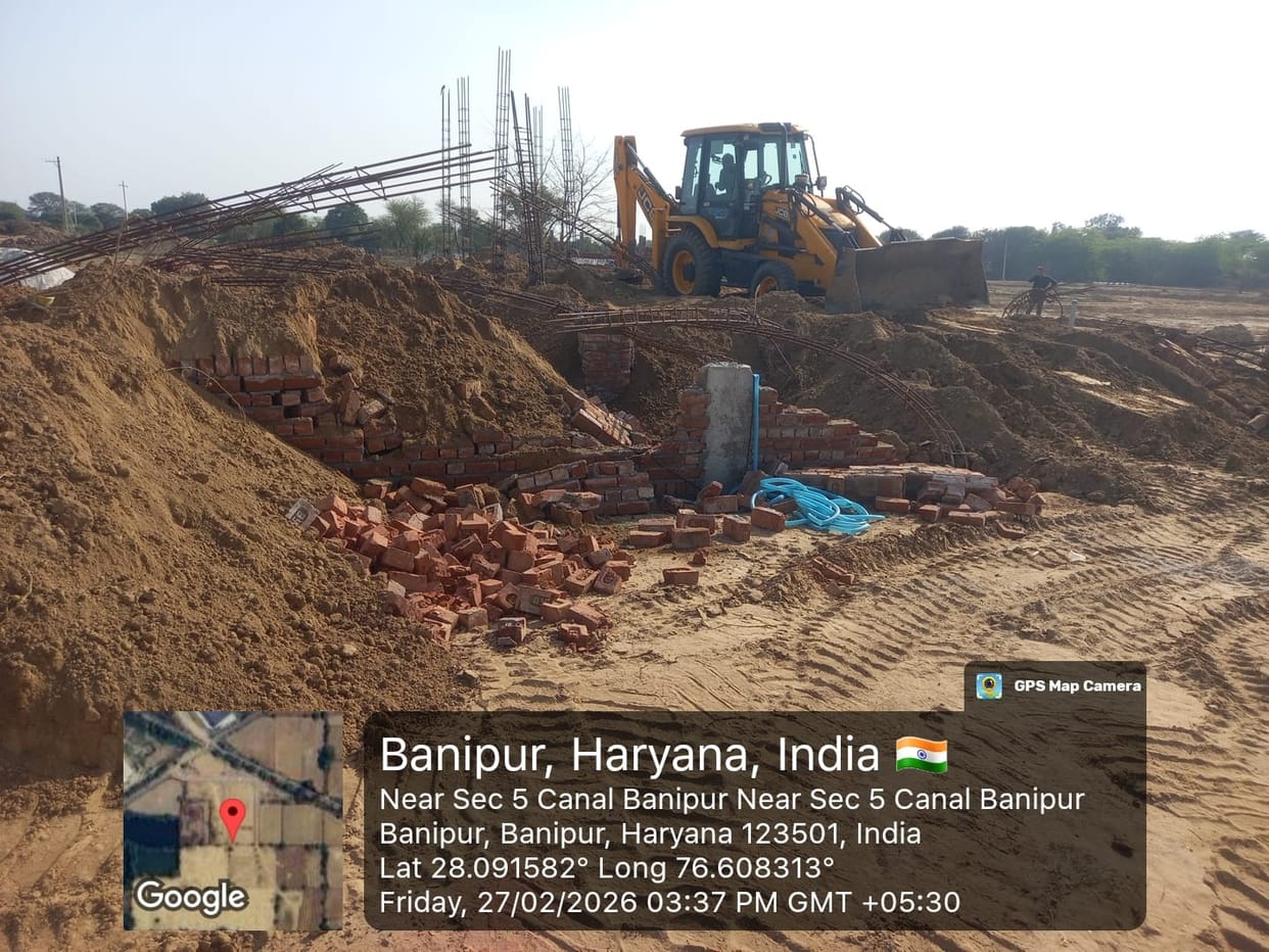 Bulldozers run on construction in illegally developed colony